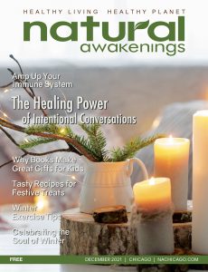Natural Awakenings Chicago December 2021 cover with candles lit on top of a cut stump with a vase that had twigs in it