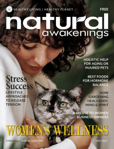 May 2023 cover of Natural Awakenings Chicago Magazine with a woman and her cat.